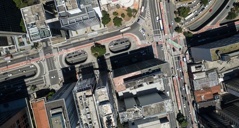 Aerial view of a dense urban area with roads, buildings, and public transportation lanes, illustrating the Pegasus TRK300’s capability for detailed asset documentation in transportation and utility network management.